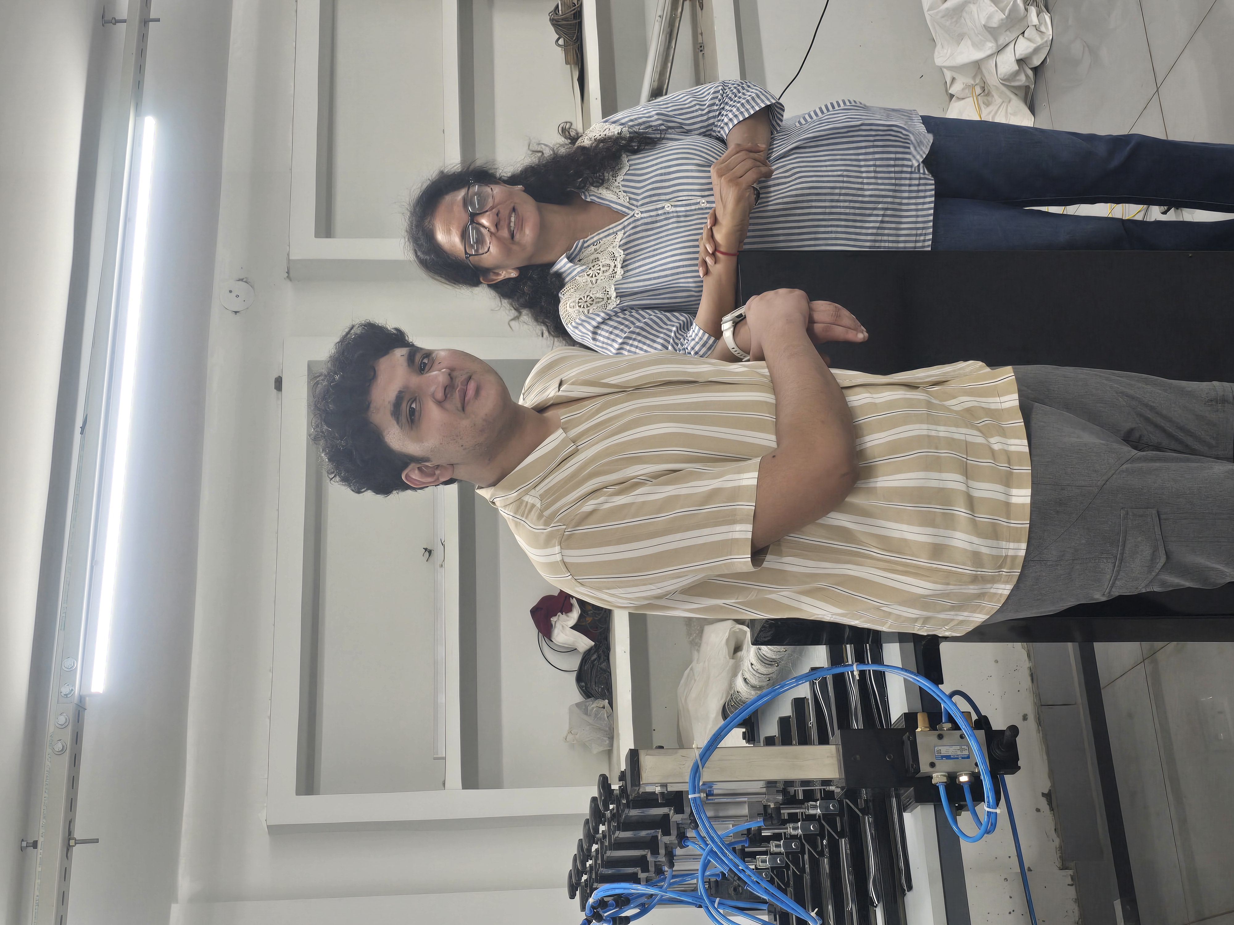 Aditya with co-inventor Namrta Singhania behind the thread-pulling machine
