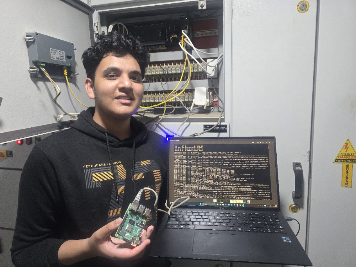 Raspberry Pi in hand with InfluxDB terminal on laptop