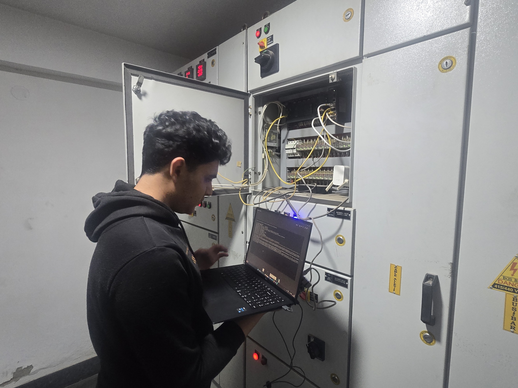 Working on a laptop at the open LT panel