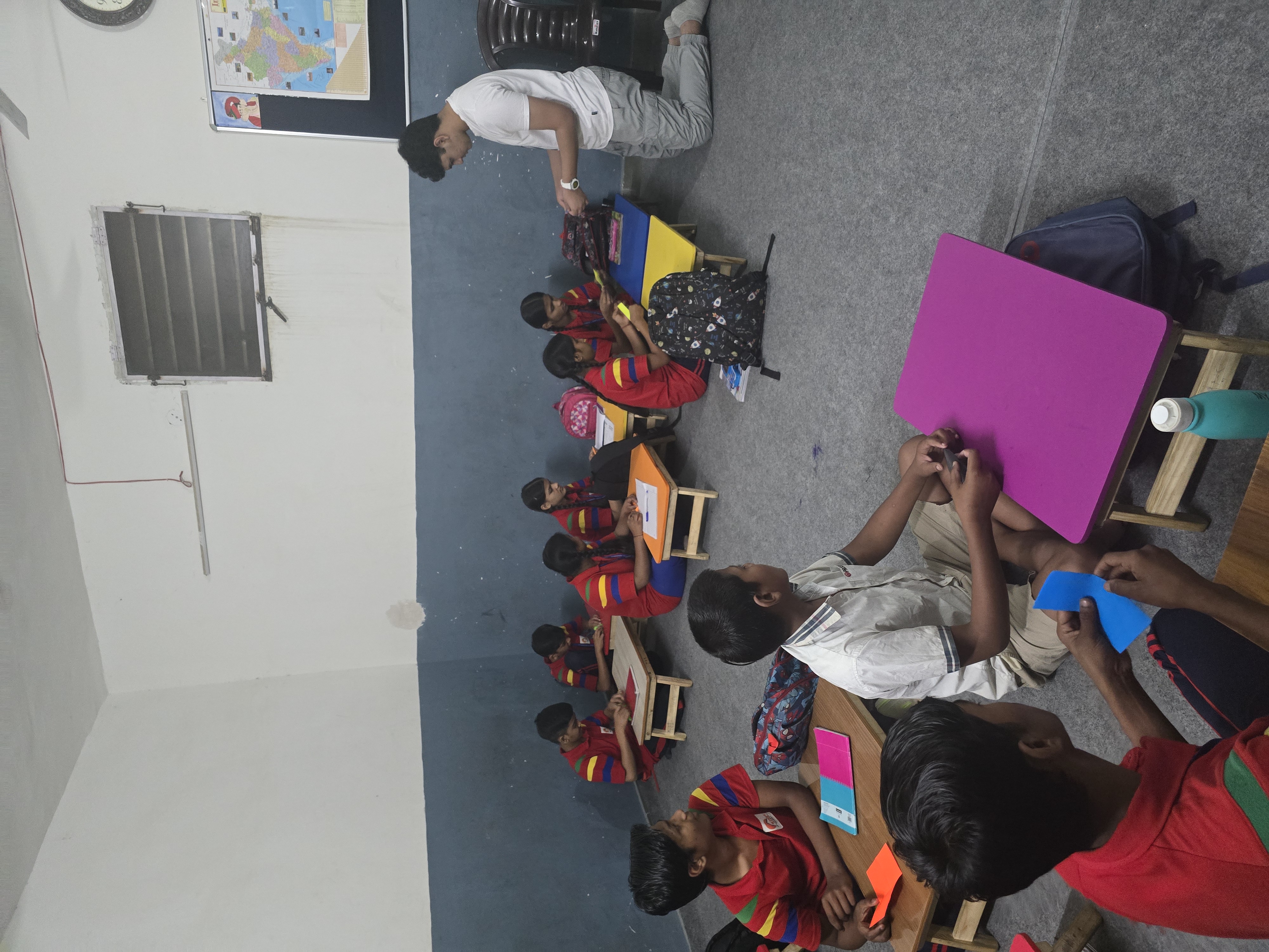 Students folding paper during the workshop