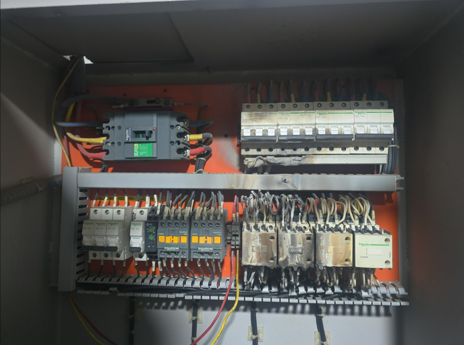 Capacitor panel with burnt contactors and scorched busbar, found after AeiX flagged low power factor